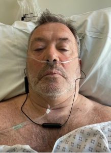Andrew Parker in hospital bed following stoma surgery