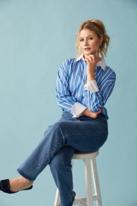 Mollie Pearce sits on a stool