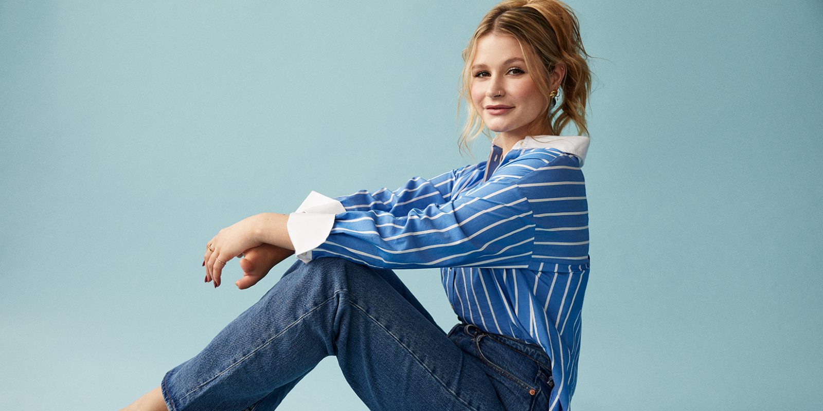 Mollie Pearce sitting down wearing jeans and shirt