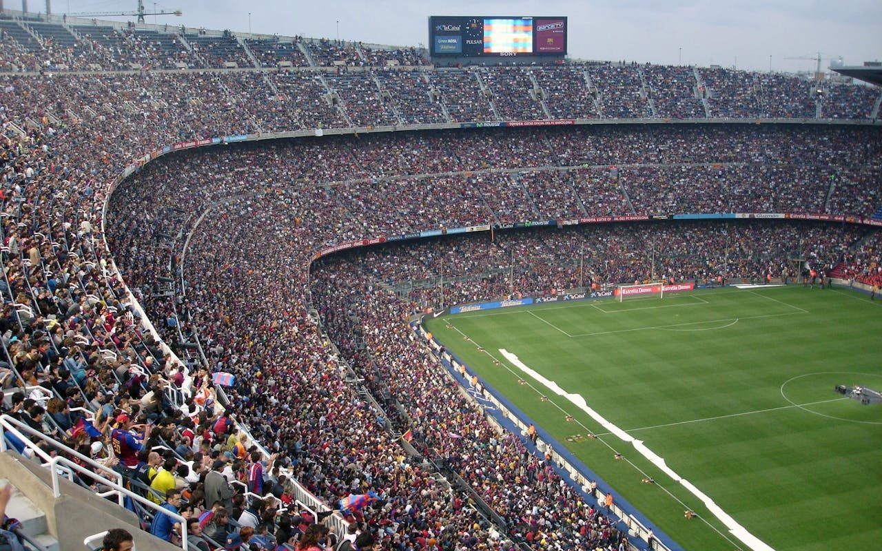 A crowd seated at a large outdoor stadium