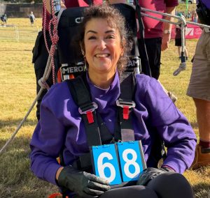 Hot air balloon pilot Jo Bailey holds a card labelled 68 - the number of tethered ascents she made for her world record challenge.
