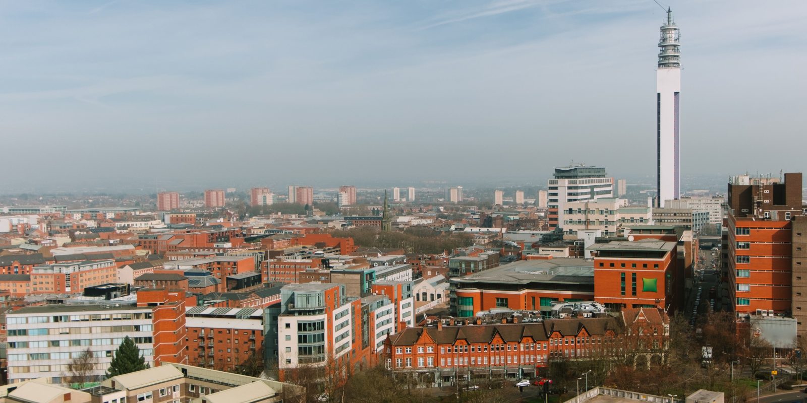 Panoramic view of Birmingham, UK showcasing the BT Tower and urban skyline.